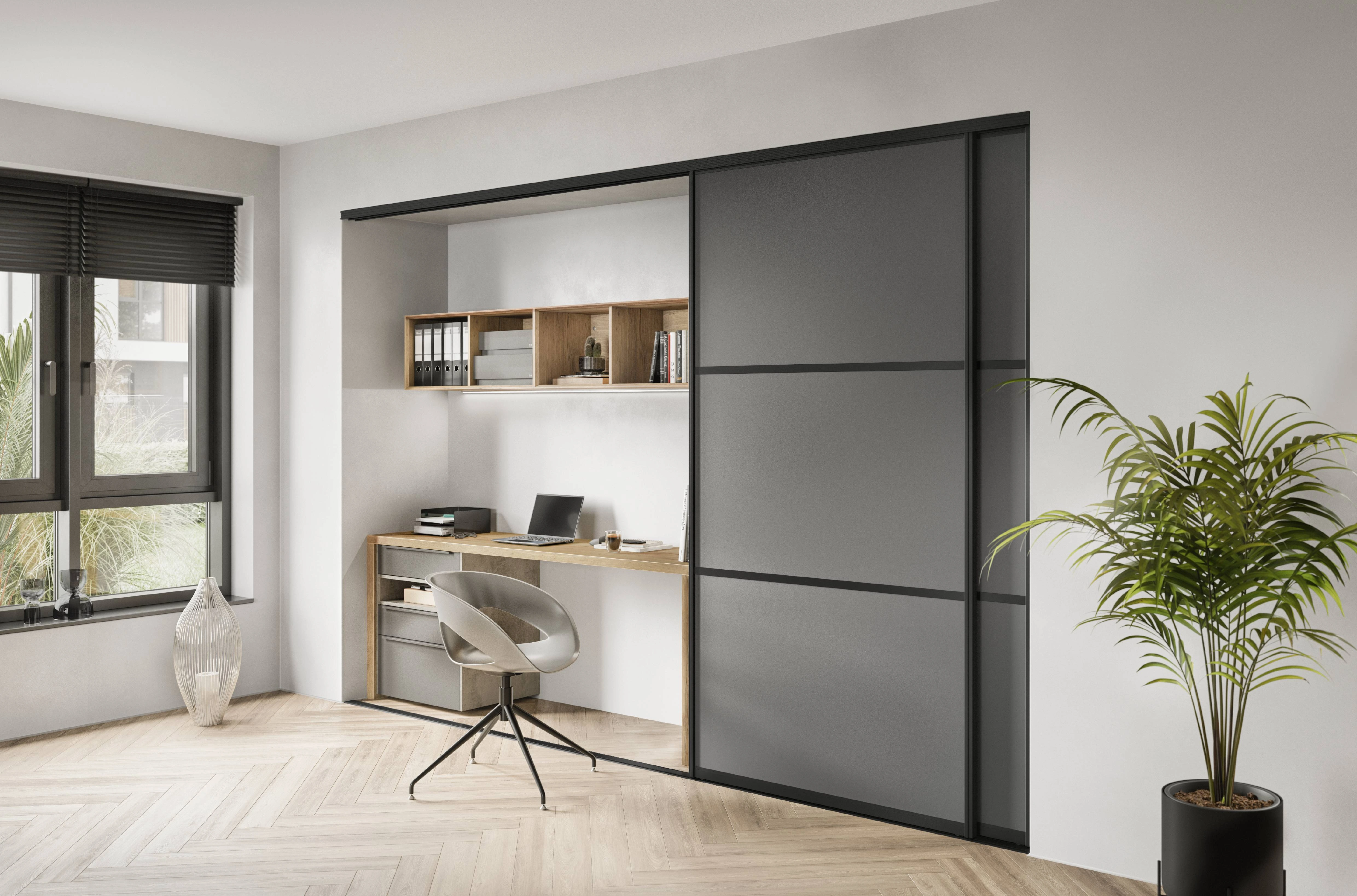 Bureau intégré sur mesure dissimulé derrière une porte coulissante grise Bureau intégré sur mesure dissimulé derrière une porte coulissante grise